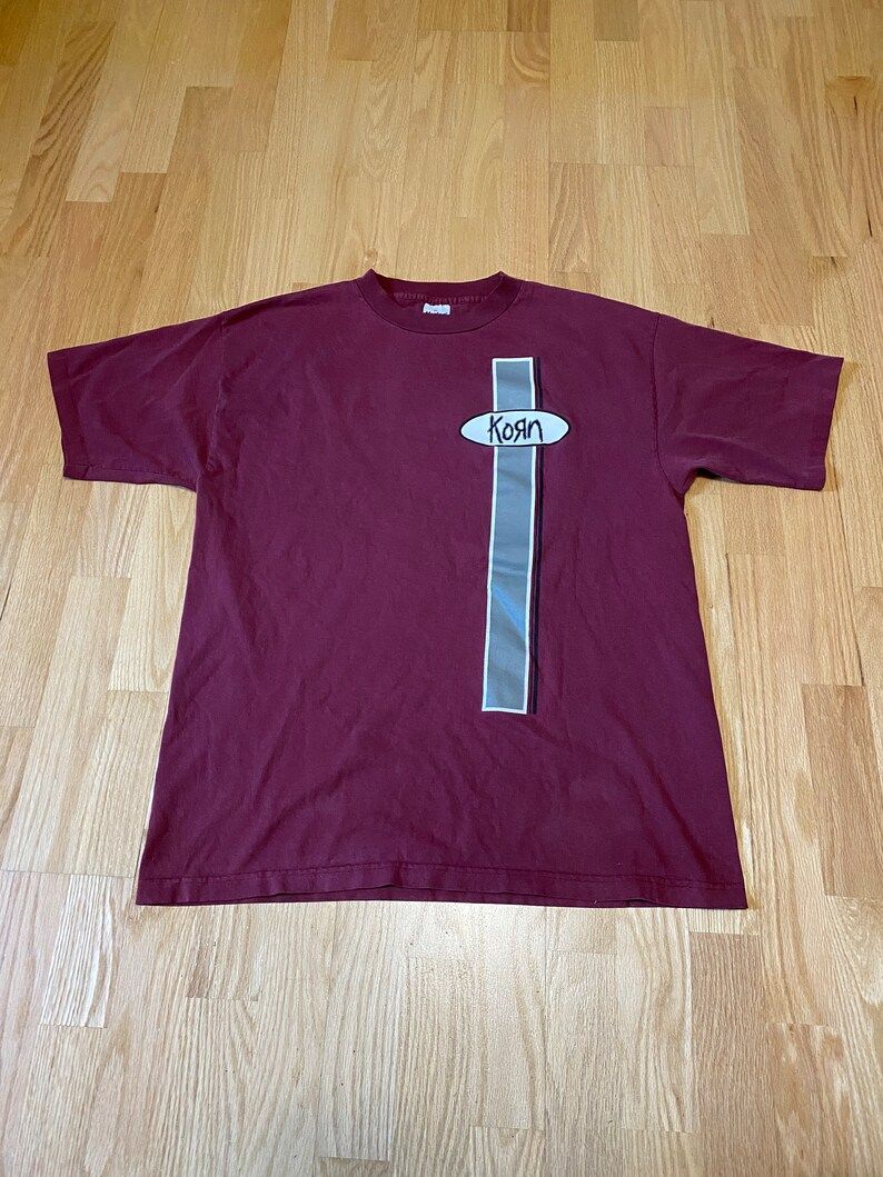 Korn Maroon Oval Spell Out Murina Cotton Single Stitch Short Sleeve T Shirt