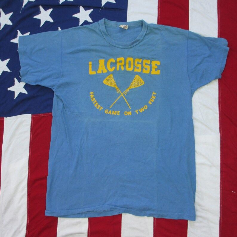 Vintage 1970S Lacrosse Fastest Game On Two Feet Russell Athletic T Shirt Small Medium Soft Light Blue Yellow Sticks Well Worn Faded