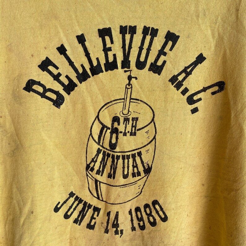 Vintage 1980 80S Russell Brand Beat Up Oil And Paint Stained Soft Pale Yellow Faded T Shirt Bellevue Ac