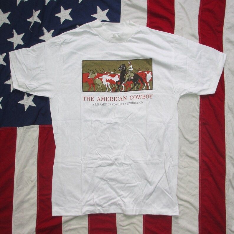 Vintage 1980S The American Cowboy A Library Of Congress Exhibition Graphic T Shirt Medium Large Western Wear Hanes White History Art