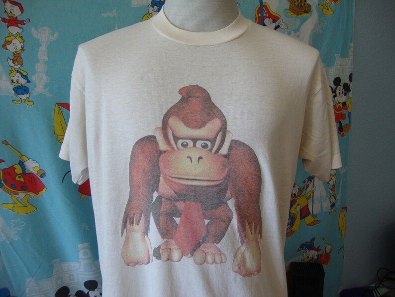 Vintage 90S Donkey Kong Country Tame The Beast Nintendo 64 Video Game Gamer Soft Paper Thin Tee Rare T Shirt vintage 90s donkey kong country tame the beast nintendo 64 video game gamer soft paper thin tee rare t shirt fpi30